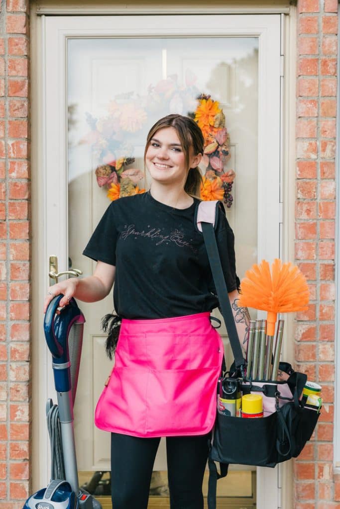 Sparkling Queens cleaning technician arriving with supplies